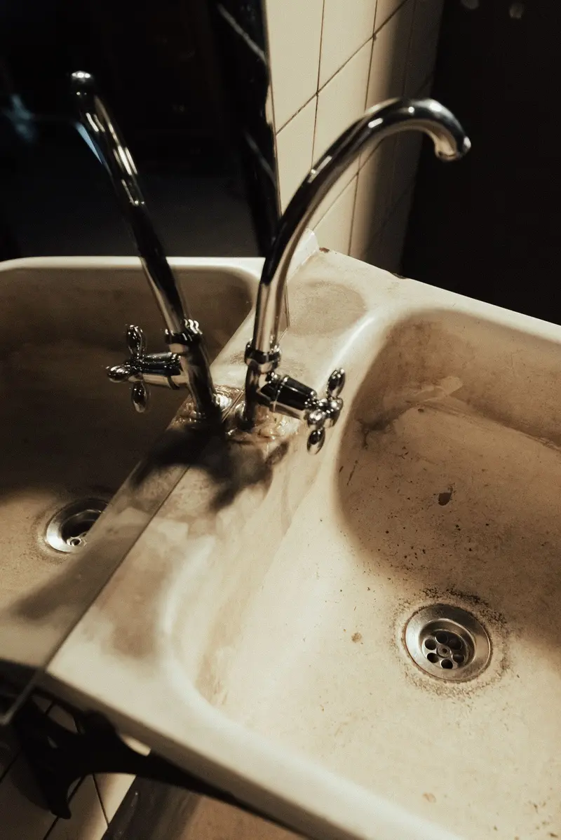 Example: neglected bathroom sink with visible dirt and grime
